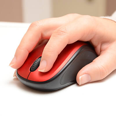 Hand operating a computer mouse